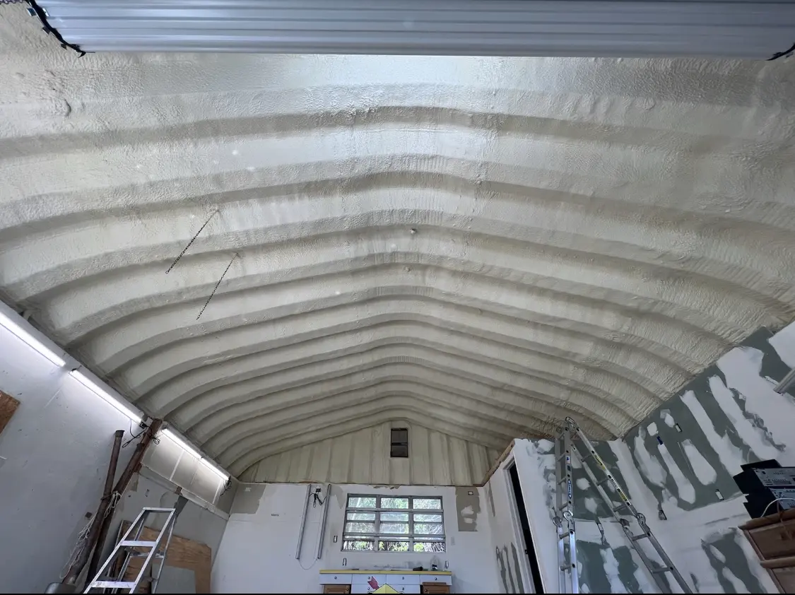 Spray polyurethane foam applied to the underside of a metal roof deck in Belvedere Park